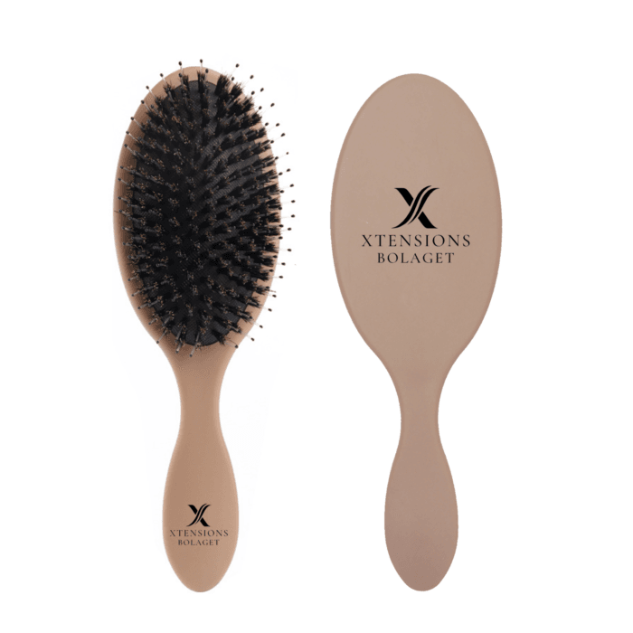 Brun extensionsborste för extensions och löshår.